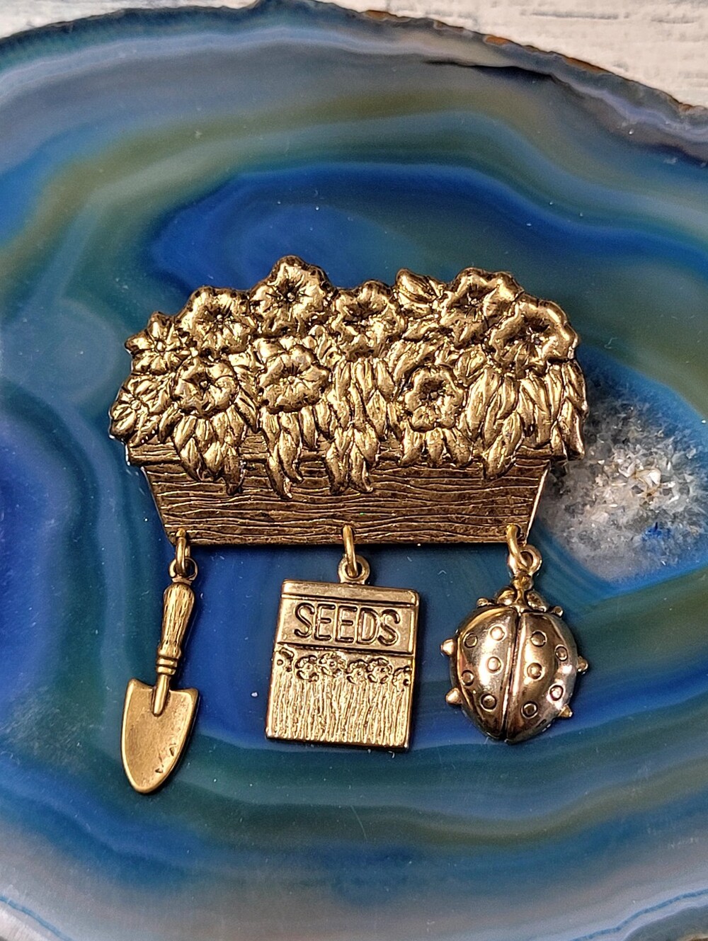 Gold-Tone Garden Planter Pin with Seed Packet & Shovel and Ladybug Charms